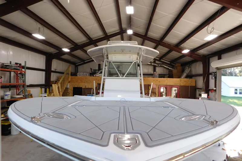  Yacht Photos Pics 2003 Regulator 32 Center Console boat in a spacious indoor storage facility.