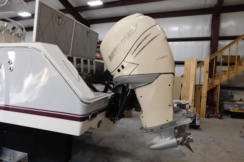  Yacht Photos Pics 2003 Regulator 32 Center Console with Mercury Verado outboard engine in a workshop setting.