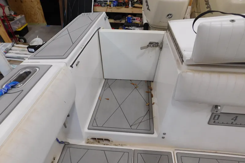  Yacht Photos Pics 2003 Regulator 32 Center Console boat interior with open storage compartment.