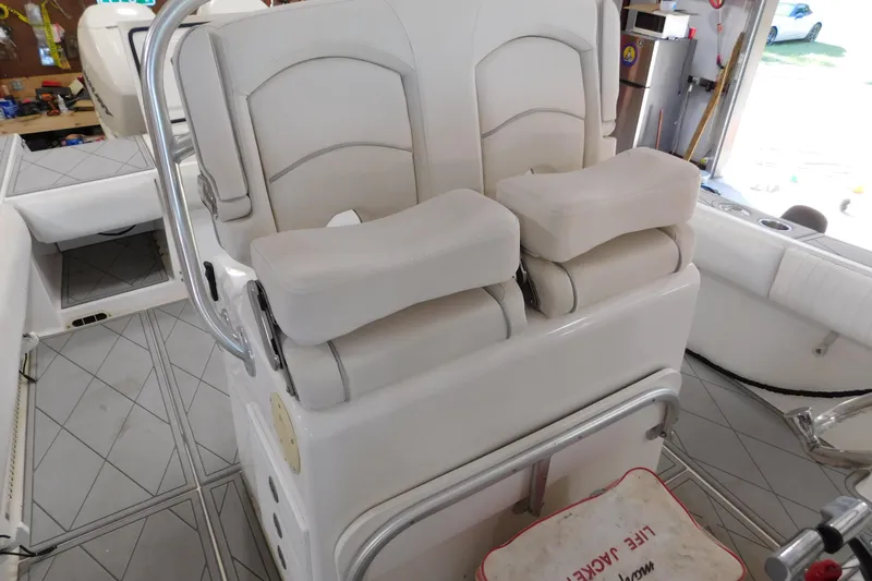  Yacht Photos Pics 2003 Regulator 32 Center Console boat interior with cushioned seating and safety equipment.