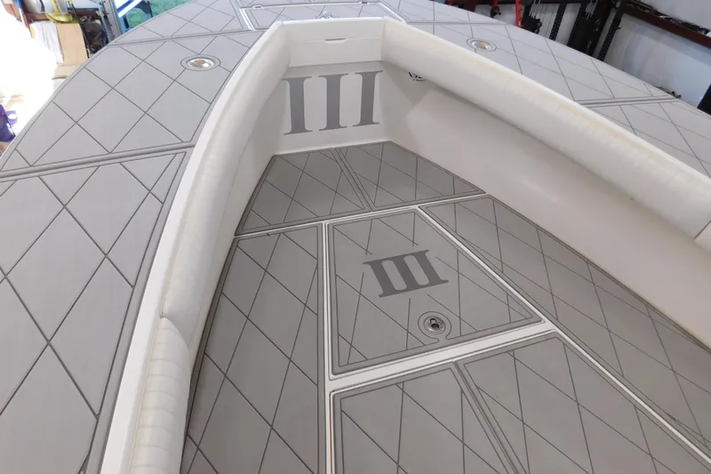  Yacht Photos Pics 2003 Regulator 32 Center Console boat deck with custom diamond pattern design.