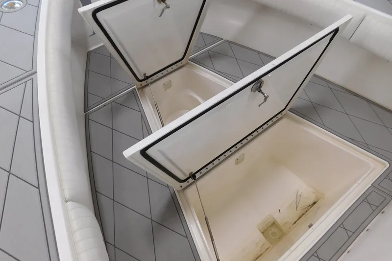  Yacht Photos Pics 2003 Regulator 32 Center Console boat with open storage compartments.