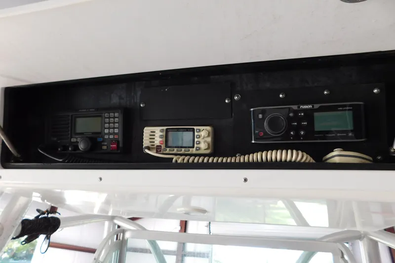  Yacht Photos Pics 2003 Regulator 32 Center Console electronics panel with communication and audio systems.