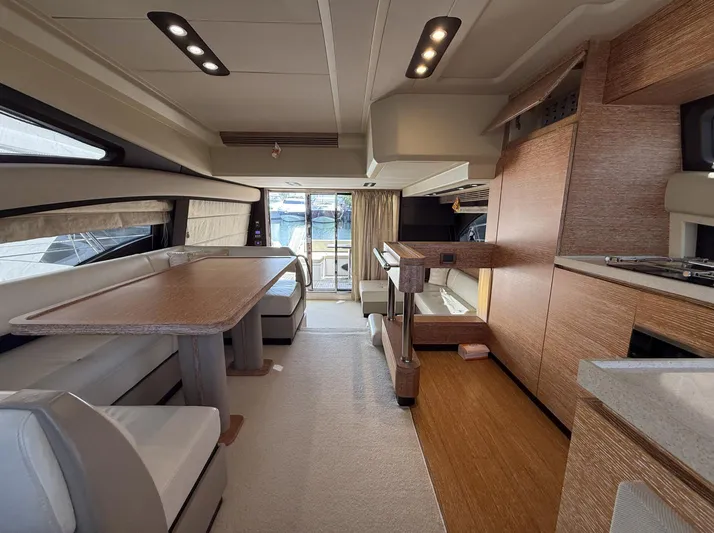  Yacht Photos Pics Luxurious interior of a 2016 Azimut 54 yacht with modern furnishings and ample natural light.