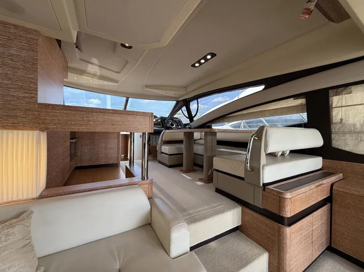  Yacht Photos Pics Luxurious interior of a 2016 Azimut 54 yacht with modern seating and elegant wood finishes.