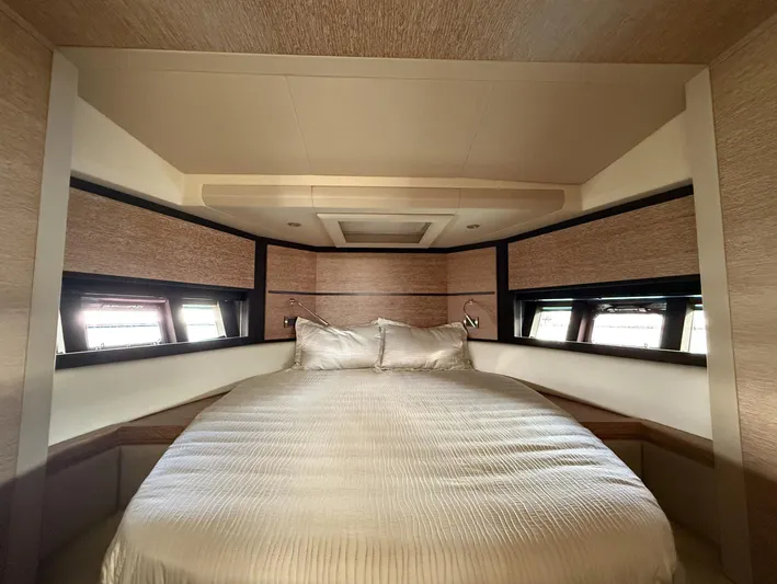  Yacht Photos Pics Luxurious bedroom interior of 2016 Azimut 54 yacht with elegant bedding and modern design.