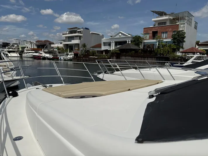  Yacht Photos Pics Azimut 54 yacht (2016) docked in a marina, surrounded by modern waterfront homes.