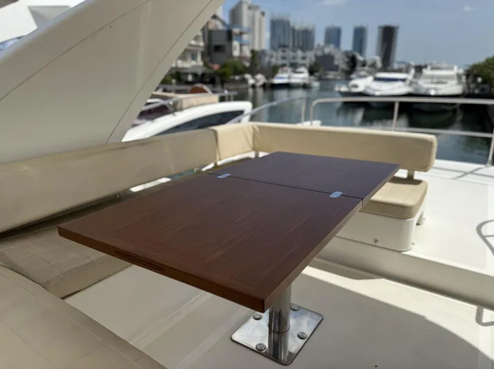  Yacht Photos Pics Luxury seating area on 2016 Azimut 54 yacht with marina view.