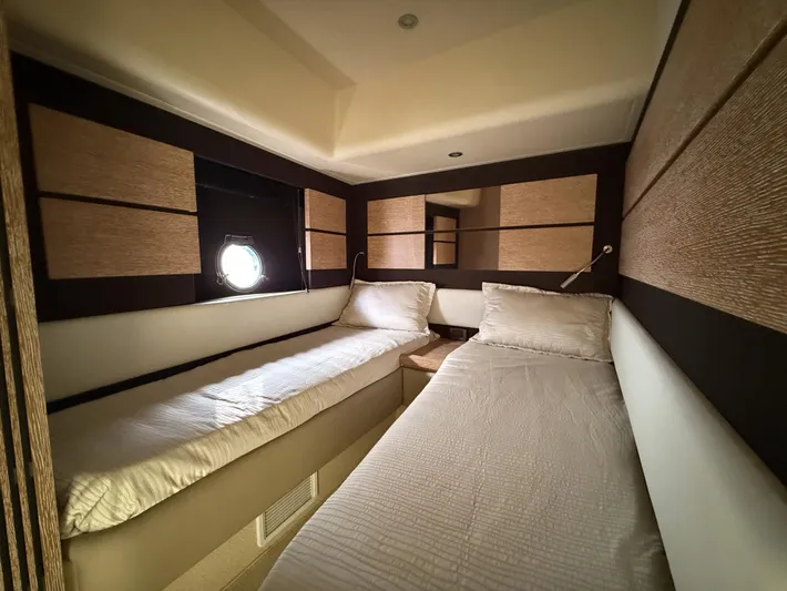  Yacht Photos Pics Interior cabin of 2016 Azimut 54 yacht with twin beds and modern design.