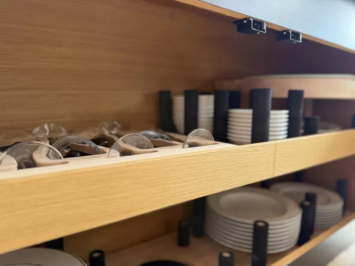  Yacht Photos Pics Cabinet with neatly organized dishes and glasses on Azimut 54 yacht, 2016 model.