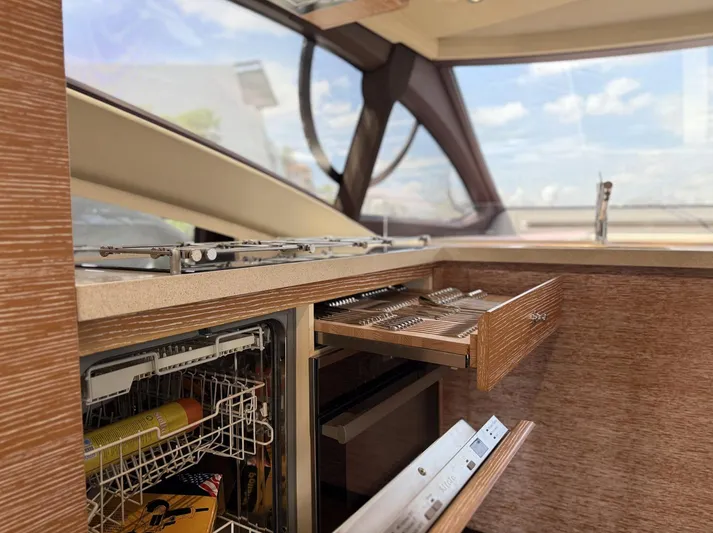  Yacht Photos Pics Interior of 2016 Azimut 54 yacht kitchen with open drawers and dishwasher.
