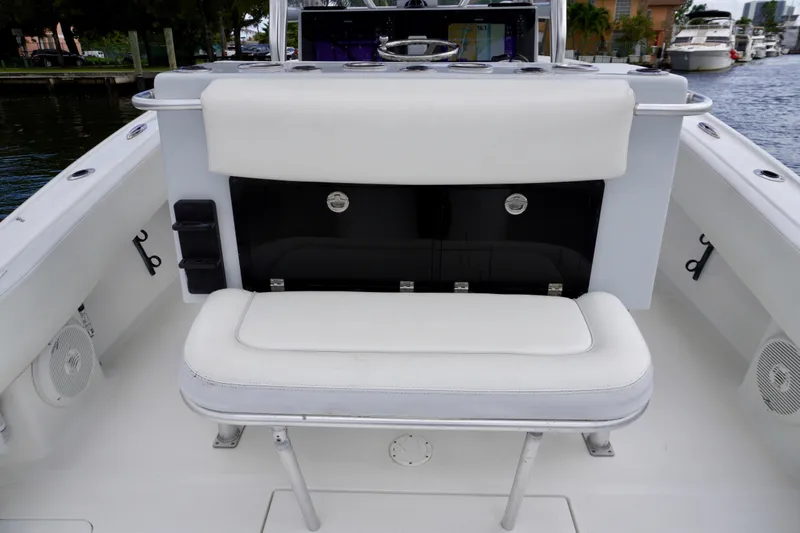  Yacht Photos Pics 2019 Dusky 33 boat interior with white seating and storage compartment.