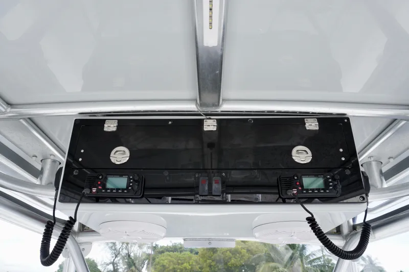  Yacht Photos Pics 2019 Dusky 33 boat console with dual radios and storage compartment.