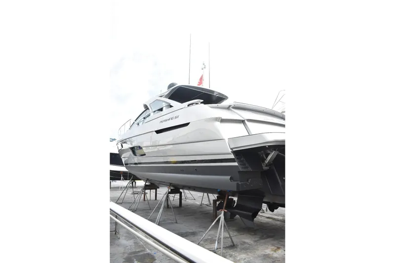 Rivo Co Rivo Yacht Photos Pics 2019 Pershing 5x yacht on dry dock, sleek design, side view.