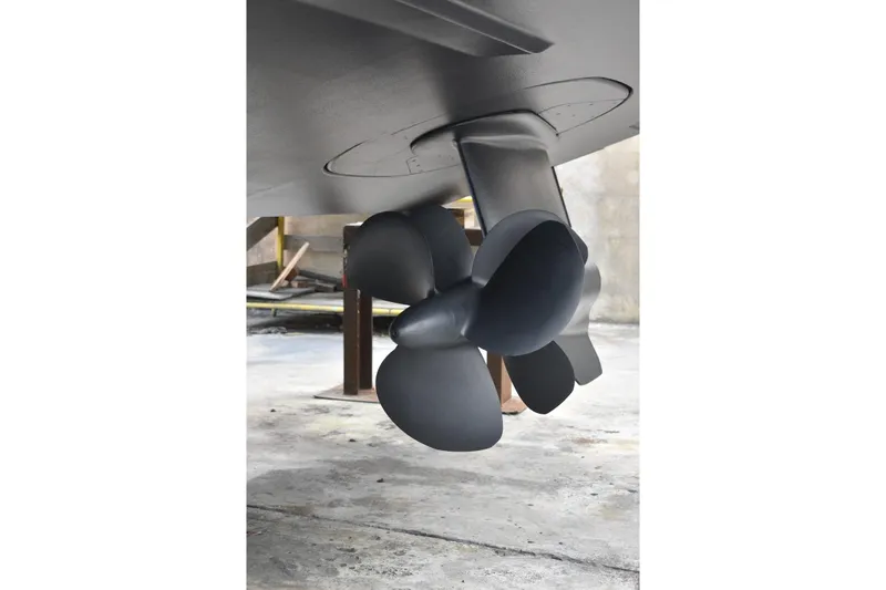 Rivo Co Rivo Yacht Photos Pics Close-up of 2019 Pershing 5x yacht propeller in a shipyard setting.