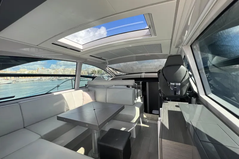 Rivo Co Rivo Yacht Photos Pics Interior of 2019 Pershing 5x yacht with modern seating and panoramic windows.
