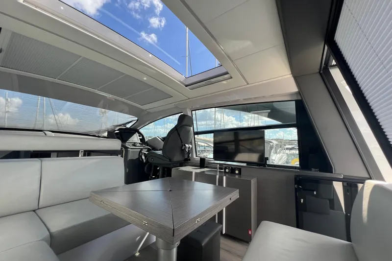 Rivo Co Rivo Yacht Photos Pics Luxurious interior of 2019 Pershing 5x yacht with modern seating and panoramic windows.