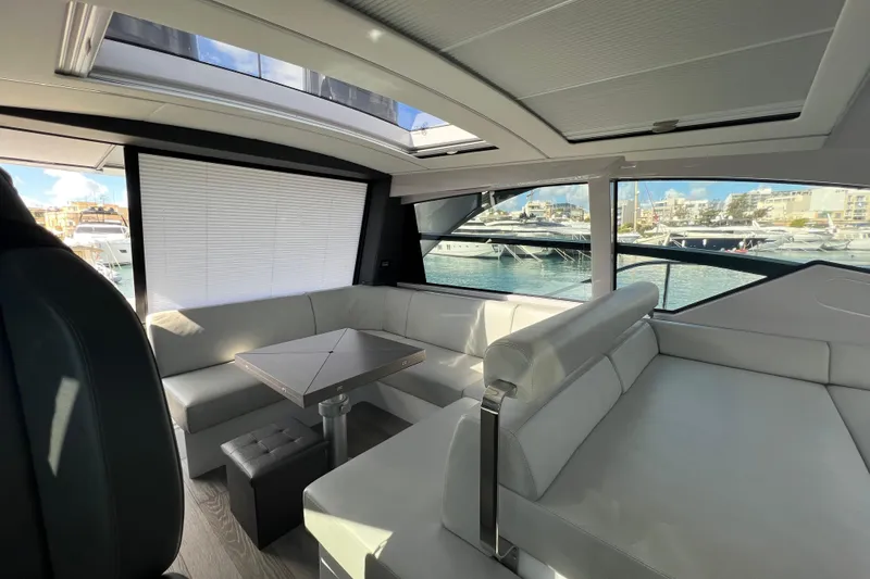 Rivo Co Rivo Yacht Photos Pics Luxurious interior of 2019 Pershing 5x yacht with modern seating and waterfront view.