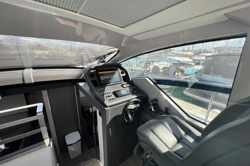 Rivo Co Rivo Yacht Photos Pics Interior cockpit of 2019 Pershing 5x yacht with modern controls and leather seating.