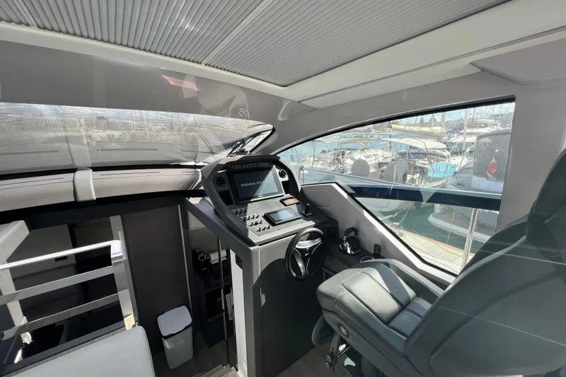 Rivo Co Rivo Yacht Photos Pics 2019 Pershing 5x yacht cockpit with modern controls and panoramic marina view.