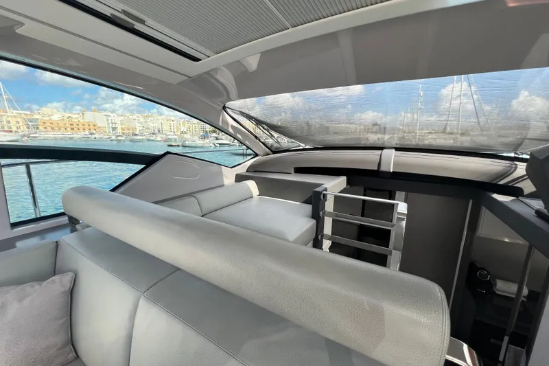 Rivo Co Rivo Yacht Photos Pics Interior of 2019 Pershing 5x yacht with modern seating and waterfront view.
