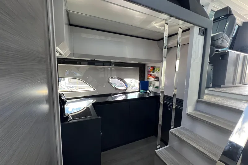 Rivo Co Rivo Yacht Photos Pics Interior of 2019 Pershing 5x yacht with modern kitchen and sleek design.