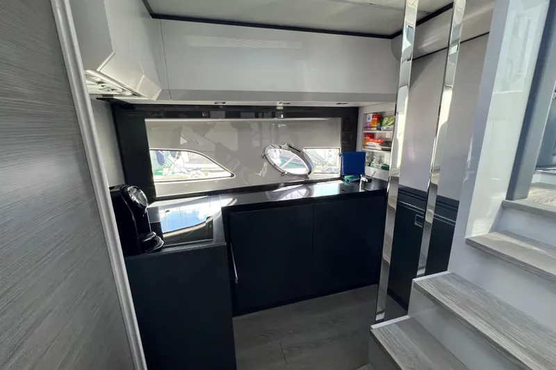 Rivo Co Rivo Yacht Photos Pics Modern kitchen interior of 2019 Pershing 5x yacht with sleek design and appliances.