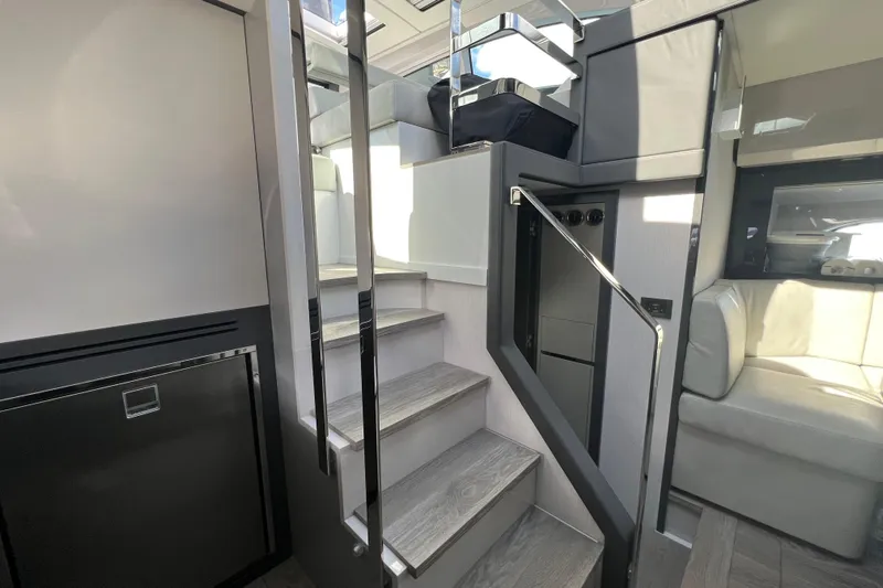 Rivo Co Rivo Yacht Photos Pics Interior of 2019 Pershing 5x yacht featuring modern stairs and sleek design elements.
