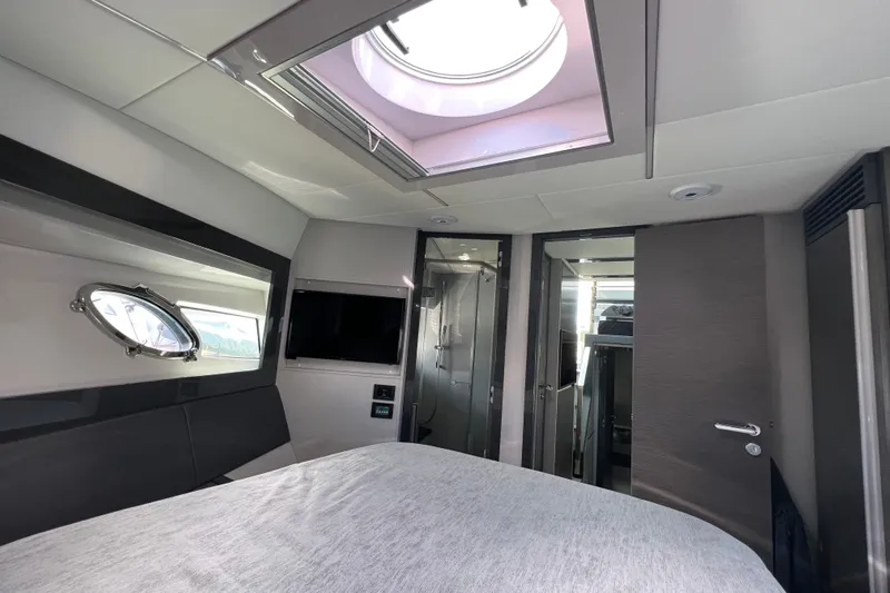 Rivo Co Rivo Yacht Photos Pics Luxurious interior of 2019 Pershing 5x yacht with skylight and modern amenities.