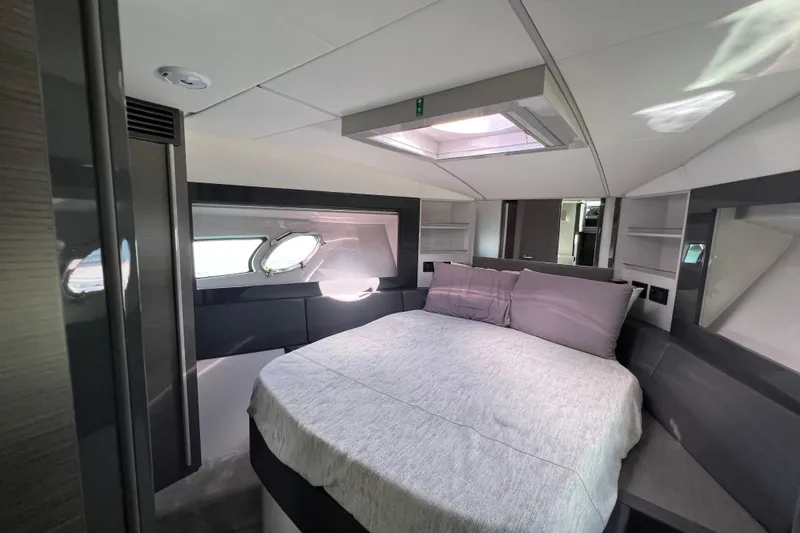 Rivo Co Rivo Yacht Photos Pics Luxurious bedroom interior of 2019 Pershing 5x yacht with modern design and skylight.