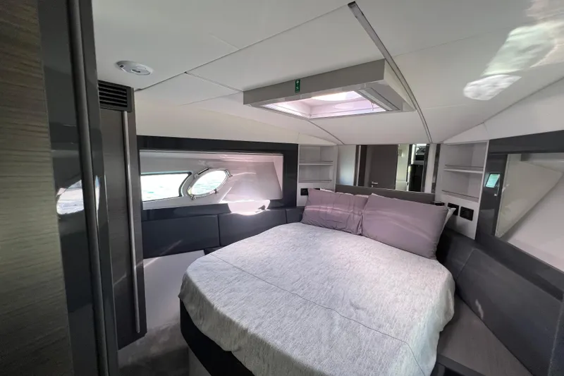 Rivo Co Rivo Yacht Photos Pics Luxurious bedroom interior of 2019 Pershing 5x yacht with modern design and natural light.