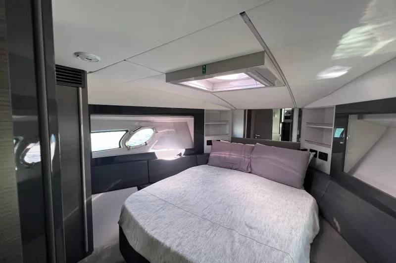 Rivo Co Rivo Yacht Photos Pics Luxurious bedroom interior of 2019 Pershing 5x yacht with modern design and natural light.