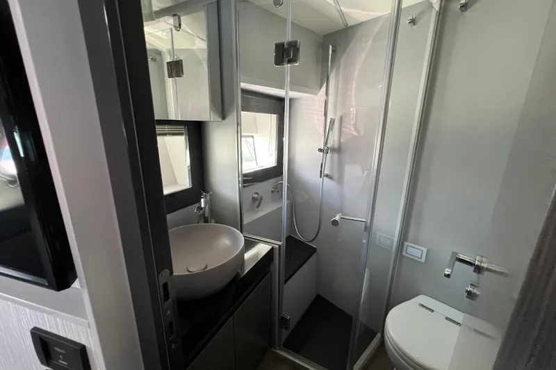 Rivo Co Rivo Yacht Photos Pics Luxurious bathroom in 2019 Pershing 5x yacht with modern fixtures and glass shower.