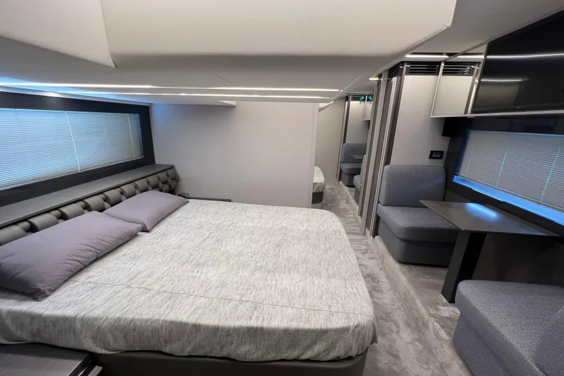 Rivo Co Rivo Yacht Photos Pics Luxurious interior of 2019 Pershing 5x yacht with modern bedroom and seating area.