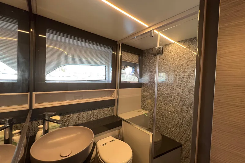 Rivo Co Rivo Yacht Photos Pics Luxurious bathroom interior of 2019 Pershing 5x yacht with modern fixtures and mosaic tiles.