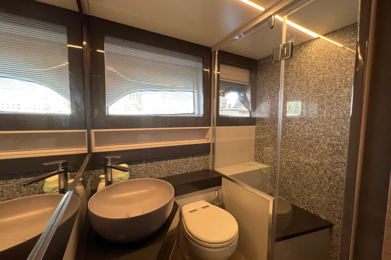 Rivo Co Rivo Yacht Photos Pics Luxurious bathroom in 2019 Pershing 5x yacht with modern fixtures and mosaic tiles.