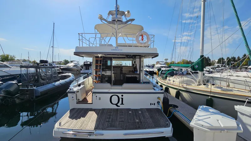  Yacht Photos Pics 2021 Cranchi Eco Trawler T43 Long Distance docked at marina, rear view.