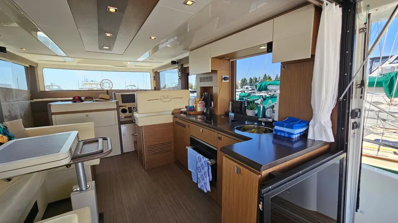  Yacht Photos Pics Interior of 2021 Cranchi Eco Trawler T43 Long Distance yacht, featuring modern kitchen and seating area.