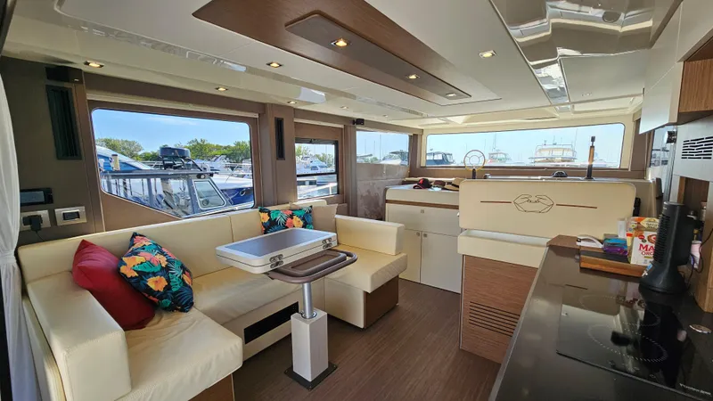  Yacht Photos Pics Luxurious interior of 2021 Cranchi Eco Trawler T43 with modern seating and vibrant cushions.
