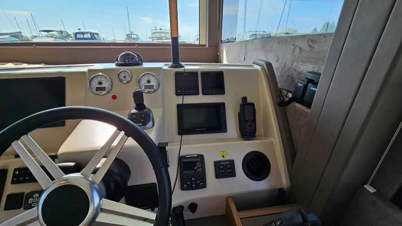  Yacht Photos Pics Helm of 2021 Cranchi Eco Trawler T43 Long Distance with navigation instruments and steering wheel.