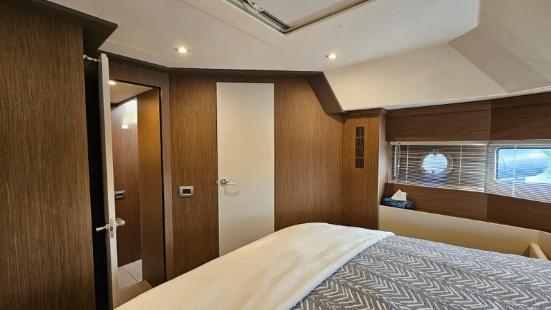  Yacht Photos Pics Interior of 2021 Cranchi Eco Trawler T43 Long Distance, featuring a cozy bedroom with wood accents.