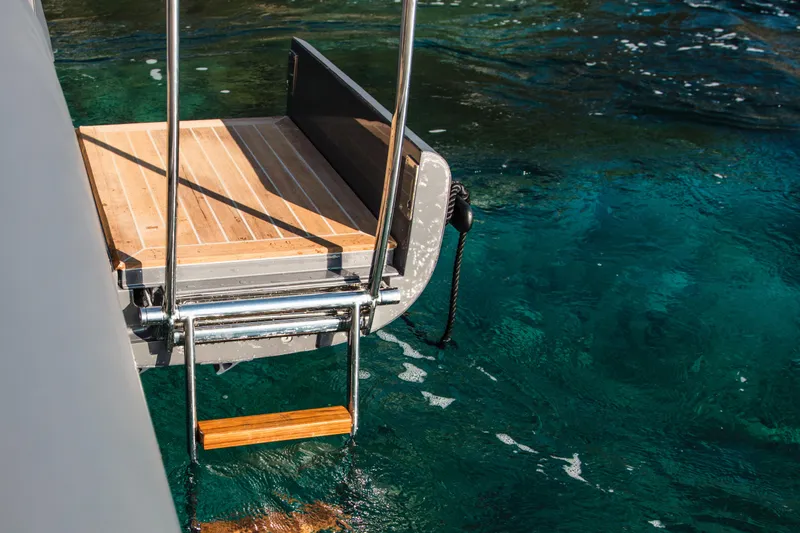 Black Shiver 120 Efb Yacht Photos Pics Novamarine Black Shiver 120 Diesel 2025 swim platform with ladder over clear blue water.