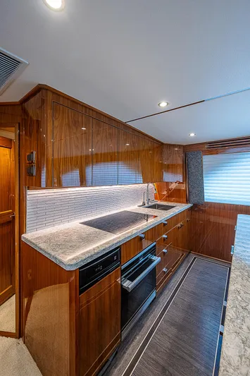 City Hands Yacht Photos Pics Modern kitchen in 2020 Viking 68 Convertible yacht with sleek wood cabinetry.