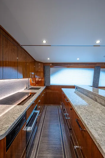 City Hands Yacht Photos Pics Luxurious kitchen interior of 2020 Viking 68 Convertible yacht with modern amenities.