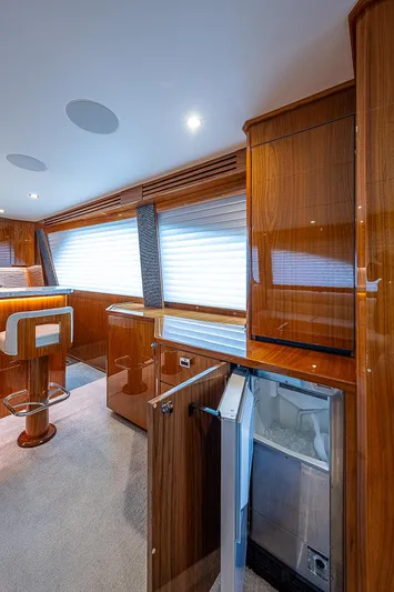City Hands Yacht Photos Pics Interior of 2020 Viking 68 Convertible yacht with modern wooden cabinetry.