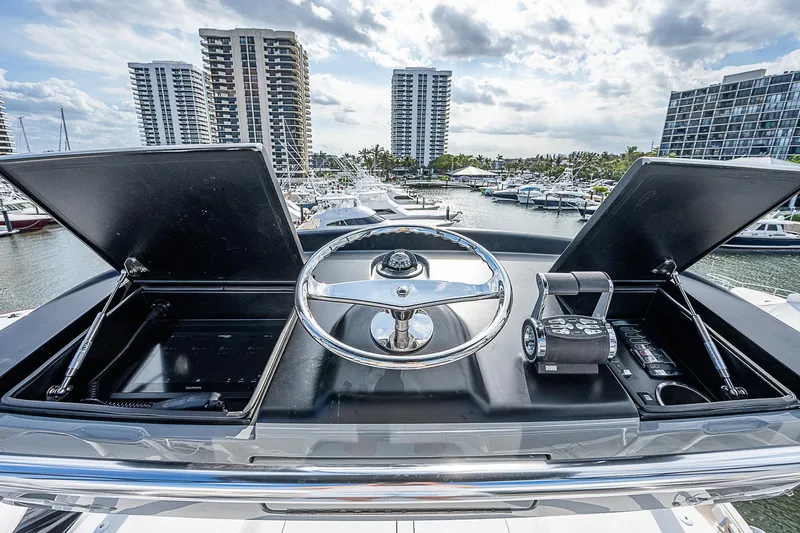 City Hands Yacht Photos Pics Control console of a 2020 Viking 68 Convertible yacht in a marina.