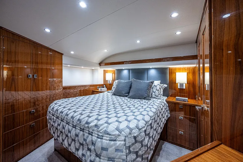 City Hands Yacht Photos Pics Luxurious bedroom interior of 2020 Viking 68 Convertible yacht with modern lighting.