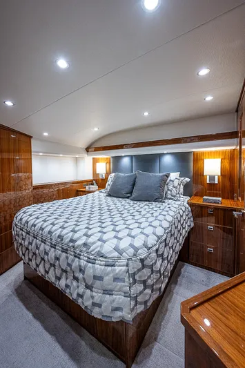 City Hands Yacht Photos Pics Luxurious bedroom interior of 2020 Viking 68 Convertible yacht with modern lighting.