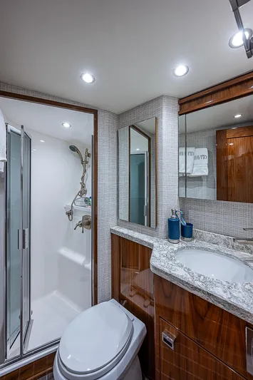 City Hands Yacht Photos Pics Luxurious bathroom in 2020 Viking 68 Convertible yacht with modern fixtures and elegant design.