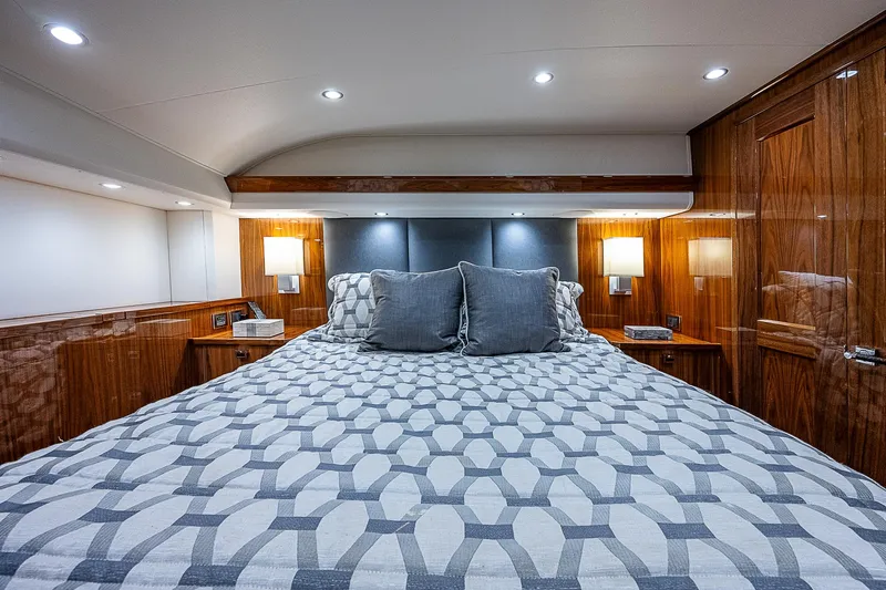 City Hands Yacht Photos Pics Luxurious bedroom interior of 2020 Viking 68 Convertible yacht with modern lighting.